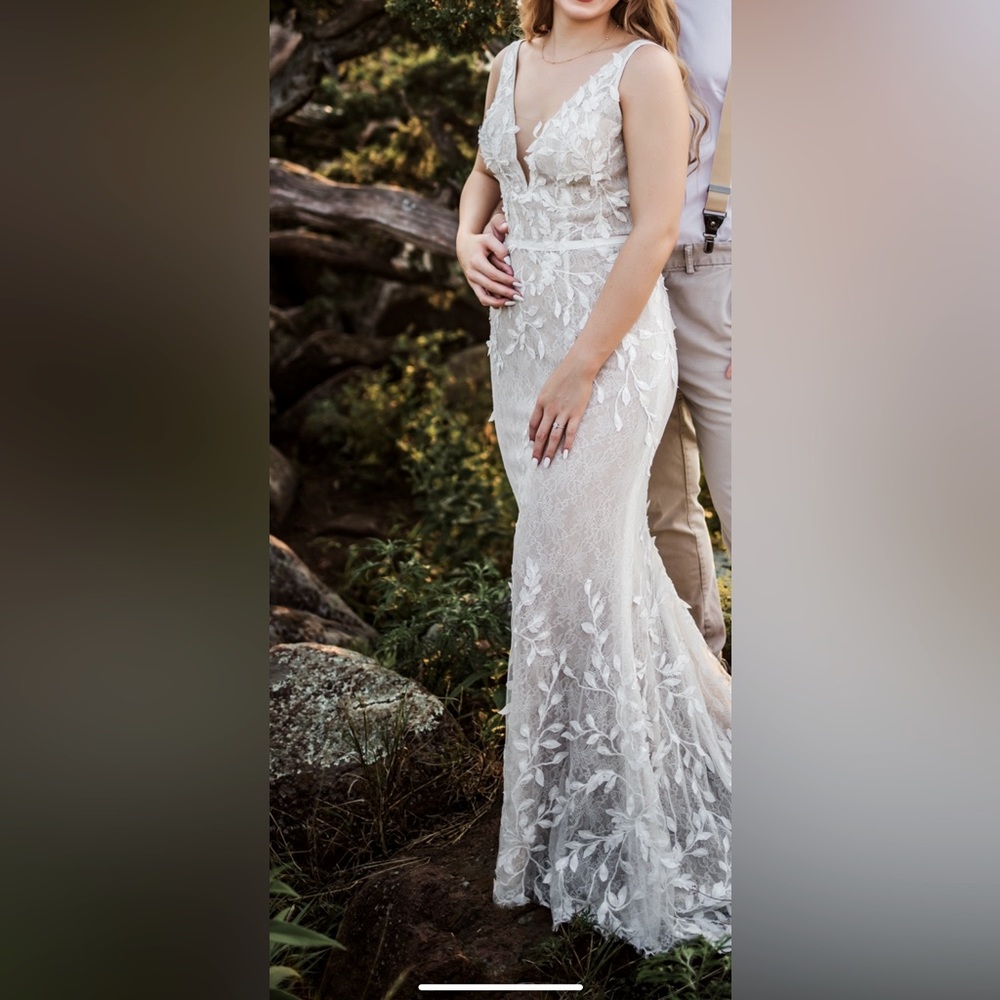 Wedding dress worn once for these pictures for 45 minutes lol…